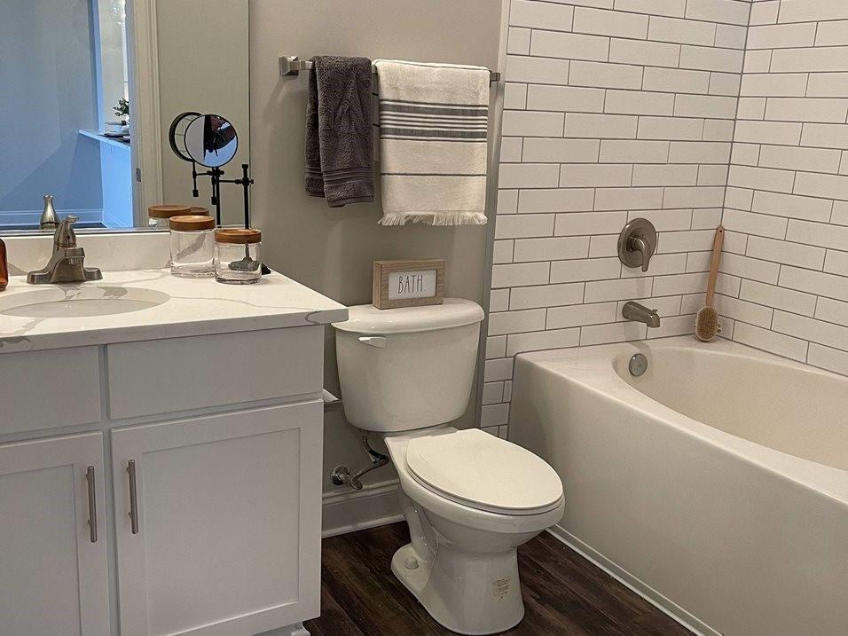 92 West Paces Ferry Road Northwest, Unit 7020 Atlanta, GA 30305 - Photo 30 of 47 a bathroom with a toilet sink and mirror