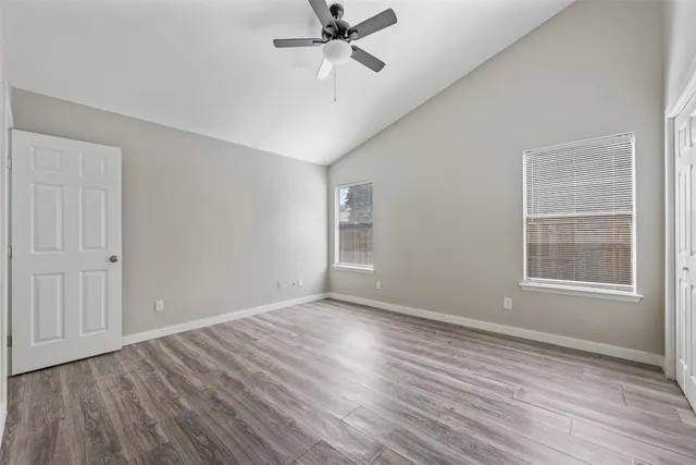 a kitchen with stainless steel appliances granite countertop grey cabinets a stove a sink and dishwasher