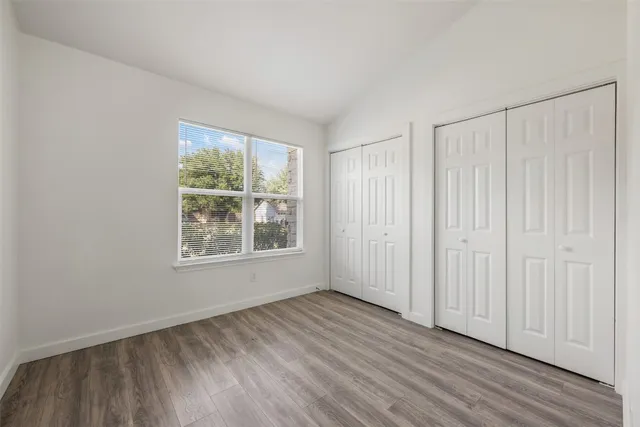 a bathroom with a toilet a sink a tub and mirror