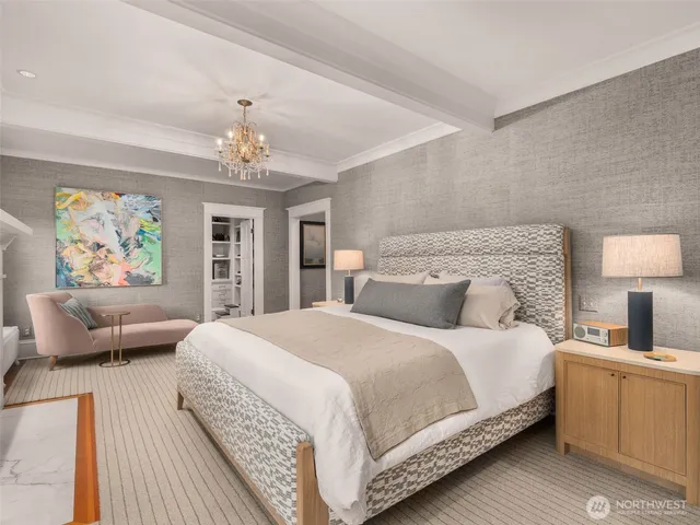 a bedroom with a large bed and a couch