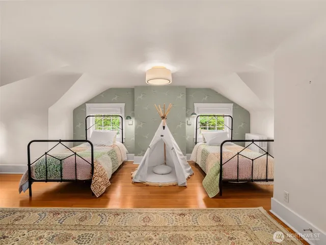 a living room with furniture and a rug