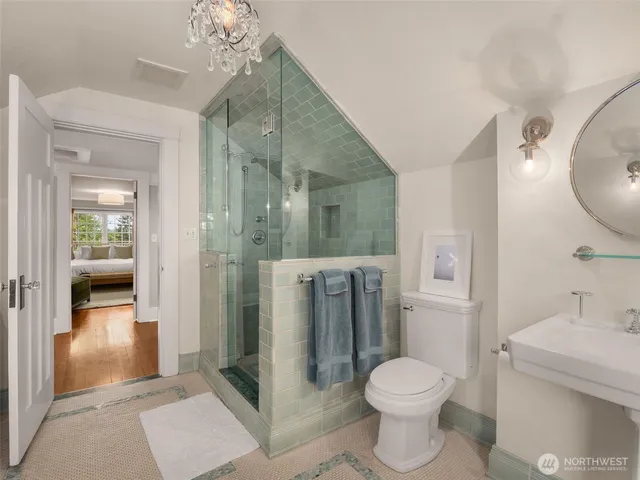 a bathroom with a toilet sink and shower