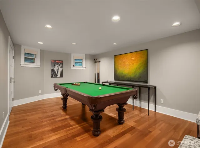 a room with furniture and pool tables