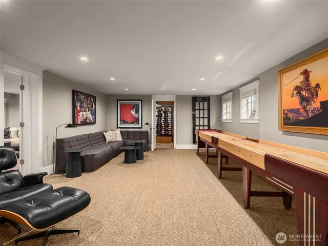 a living room with furniture a flat screen tv and a dresser
