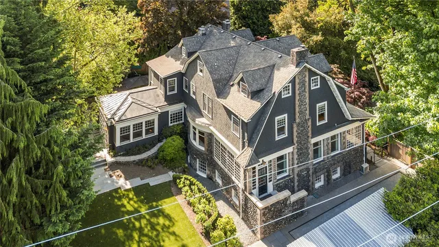a aerial view of a house with a yard