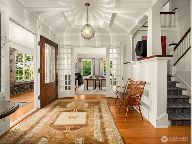 a view of a livingroom with furniture a flat screen tv and couches