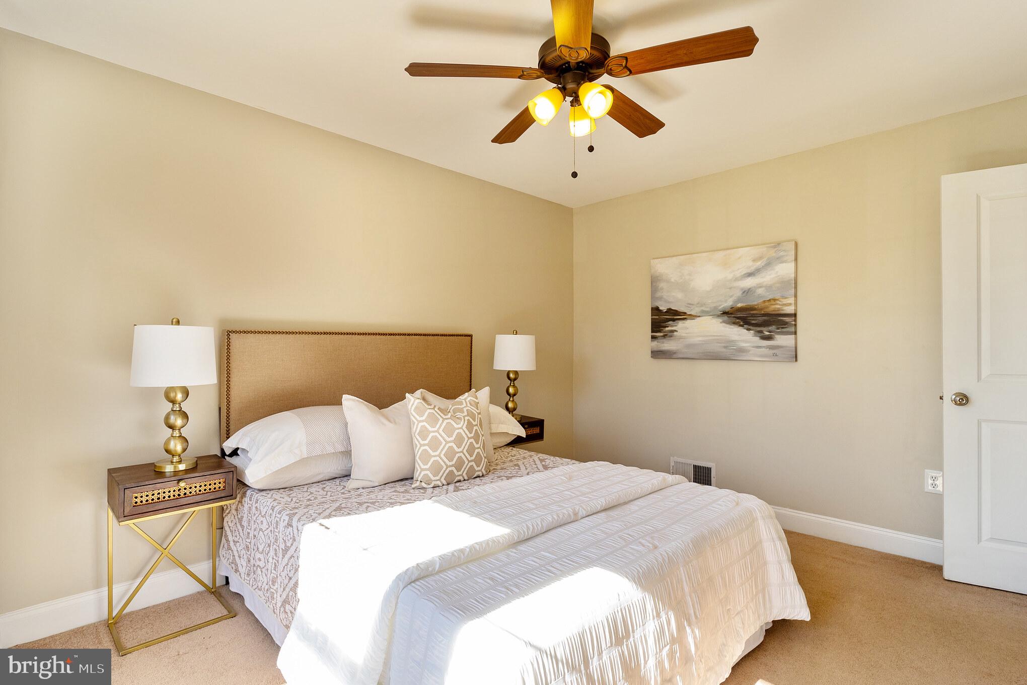 2810 Manoff Road Halethorpe, MD 21227 - Photo 12 of 27 a bedroom with a bed and a painting on the wall