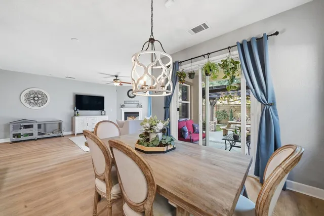 a spacious bathroom with a toilet sink and mirror