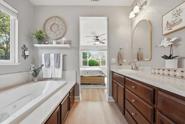 an aerial view of a house with a yard and lake view