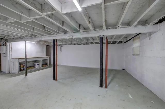 a view of a small house with a yard