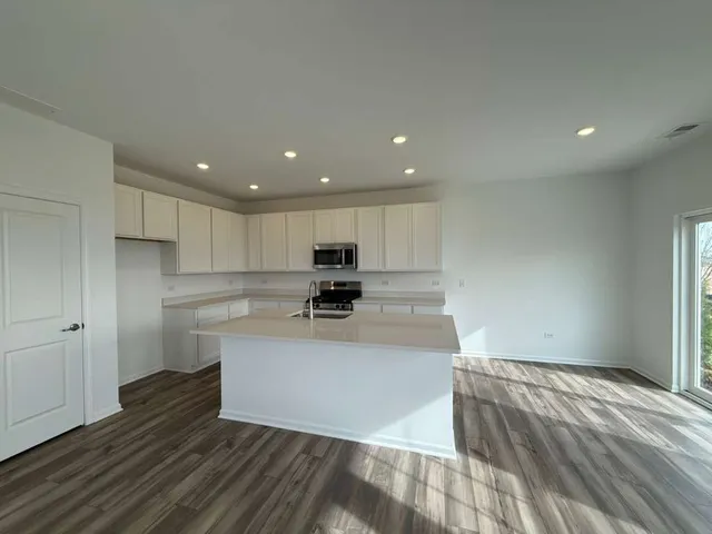 a view of kitchen with wooden floor