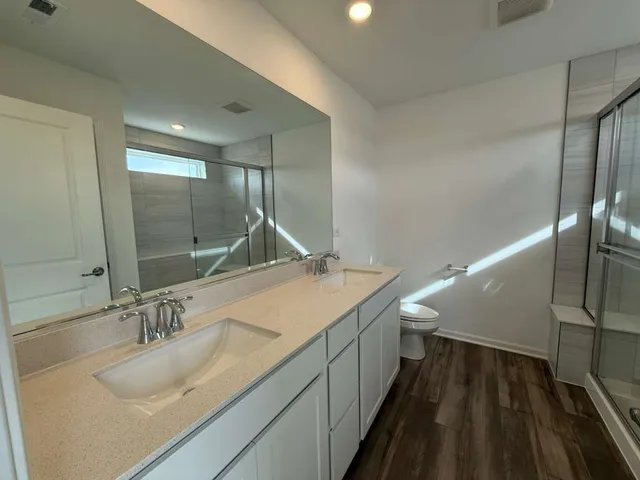 a bathroom with a sink and a large mirror
