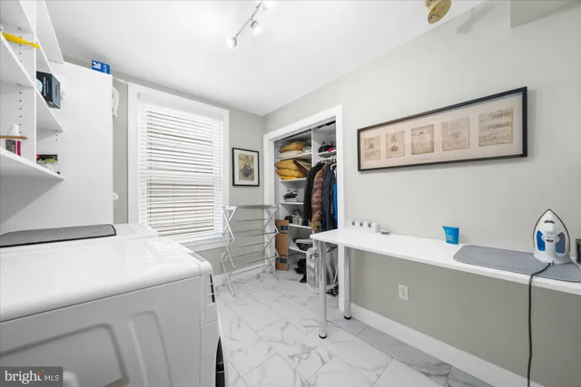 a living room with a couch and a window