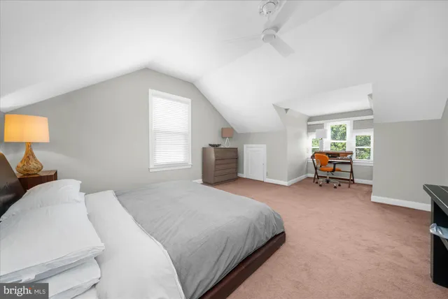 a bedroom with a bed and furniture