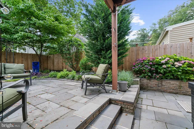 a view of a bench in the backyard