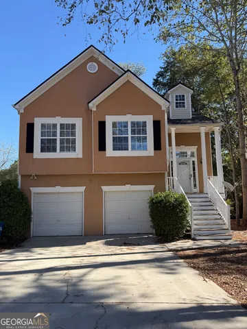 a front view of a house with a yard