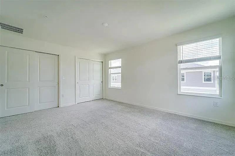 2302 Carrabelle Way Sanford, FL 32771 - Photo 18 of 24 a view of an empty room with a window
