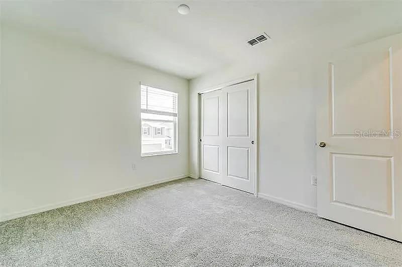 2302 Carrabelle Way Sanford, FL 32771 - Photo 21 of 24 a view of an empty room with a window