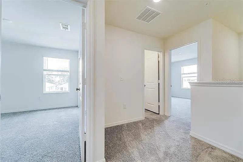 2302 Carrabelle Way Sanford, FL 32771 - Photo 22 of 24 an empty room with windows