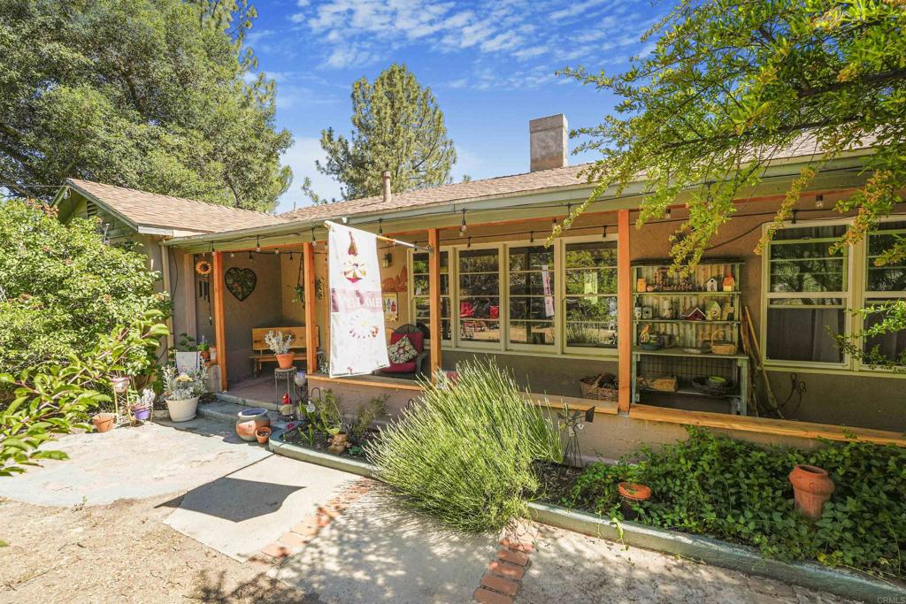 front view of a brick house with a large window