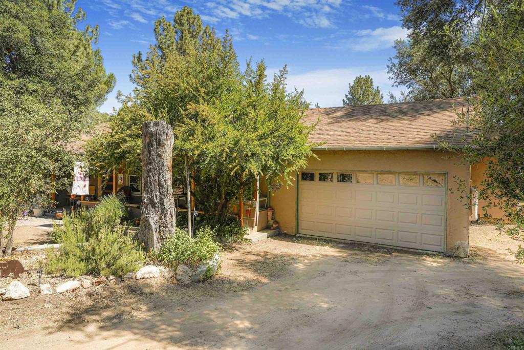 29012 Oak Lane Pine Valley, CA 91962 - Photo 14 of 38 a front view of a house with a yard and garage