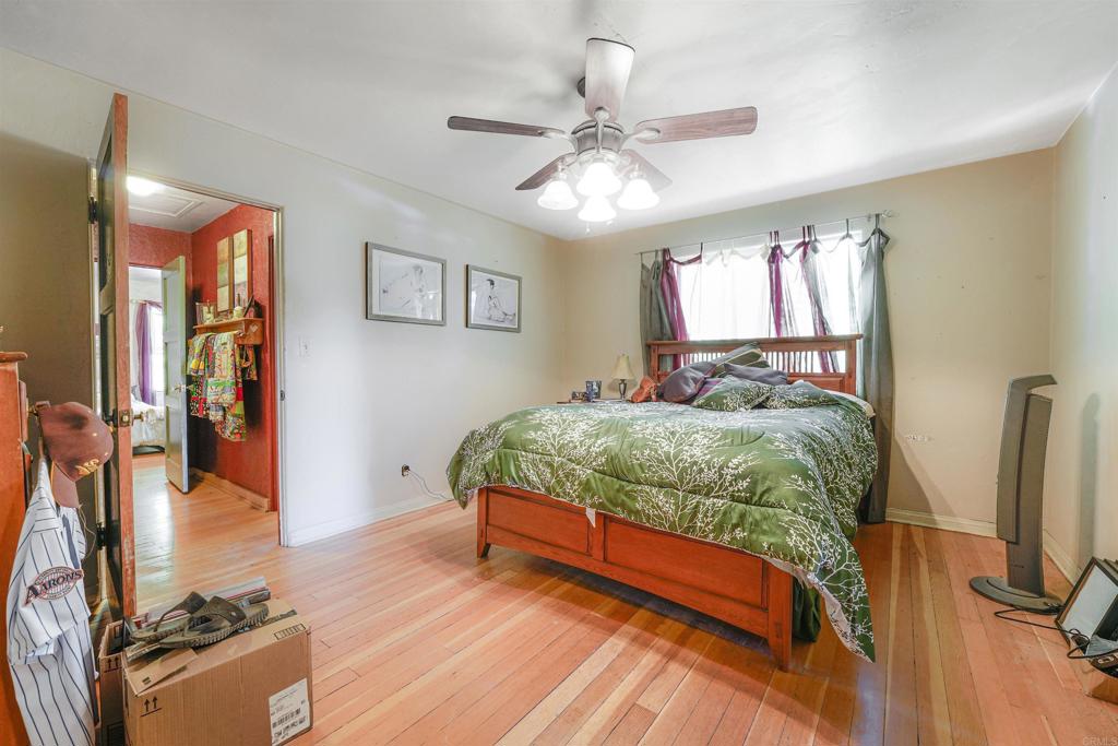 29012 Oak Lane Pine Valley, CA 91962 - Photo 25 of 38 a bedroom with a bed and a flat screen tv