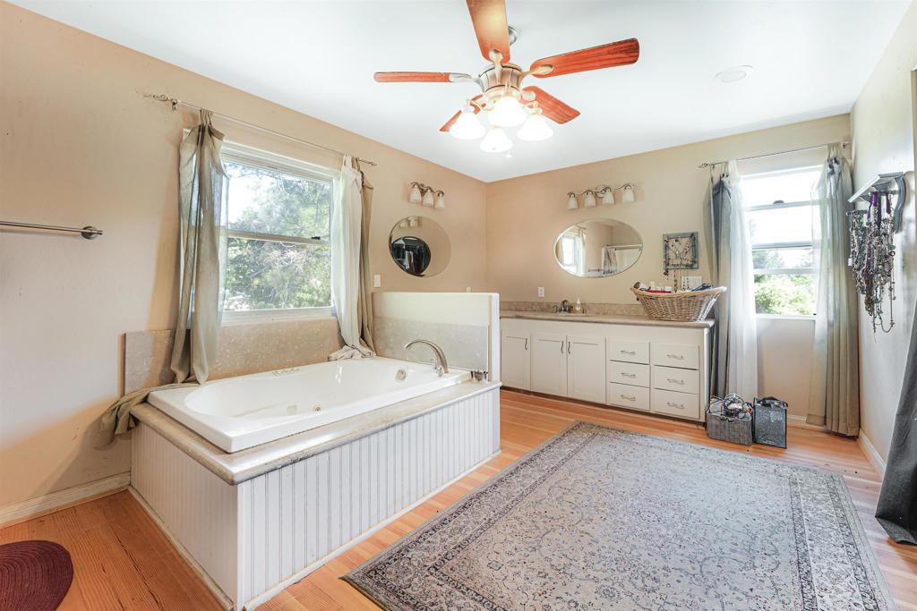 29012 Oak Lane Pine Valley, CA 91962 - Photo 27 of 38 a spacious bedroom with a bed dresser and a window