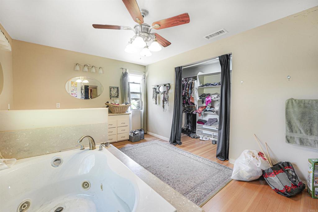 29012 Oak Lane Pine Valley, CA 91962 - Photo 29 of 38 a bathroom with a tub sink and mirror