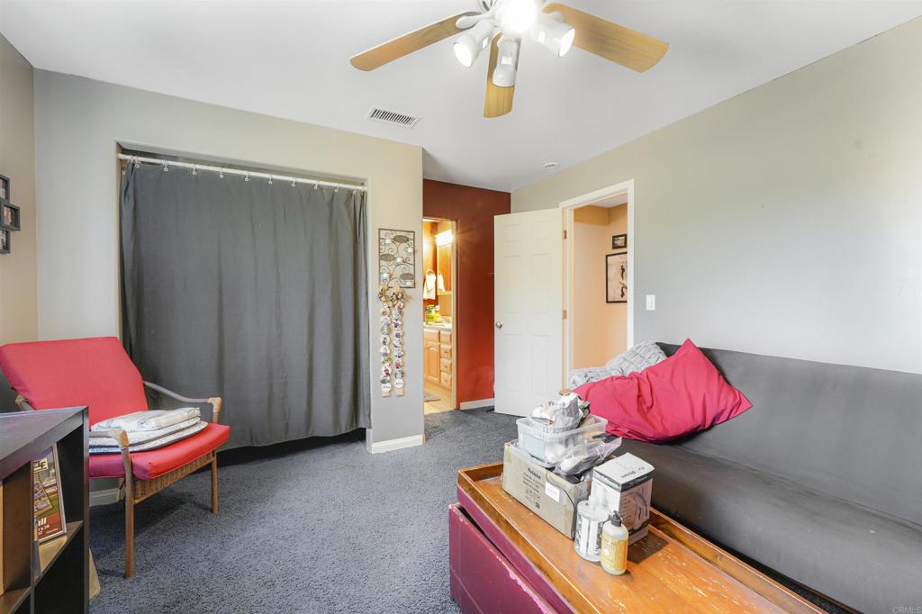 29012 Oak Lane Pine Valley, CA 91962 - Photo 36 of 38 a living room with furniture and a chandelier