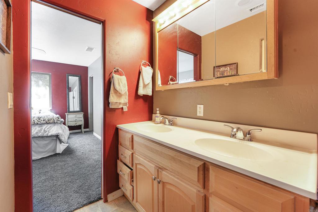 29012 Oak Lane Pine Valley, CA 91962 - Photo 37 of 38 a en suite bathroom with a sink and a mirror
