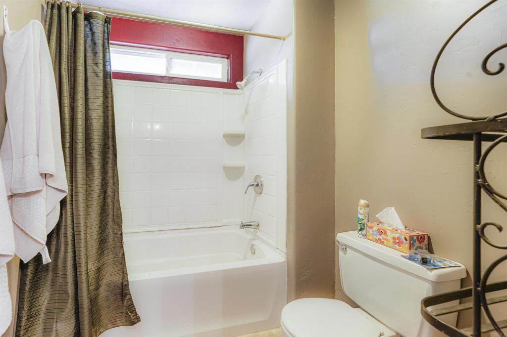29012 Oak Lane Pine Valley, CA 91962 - Photo 38 of 38 a bathroom with a toilet and a bathtub