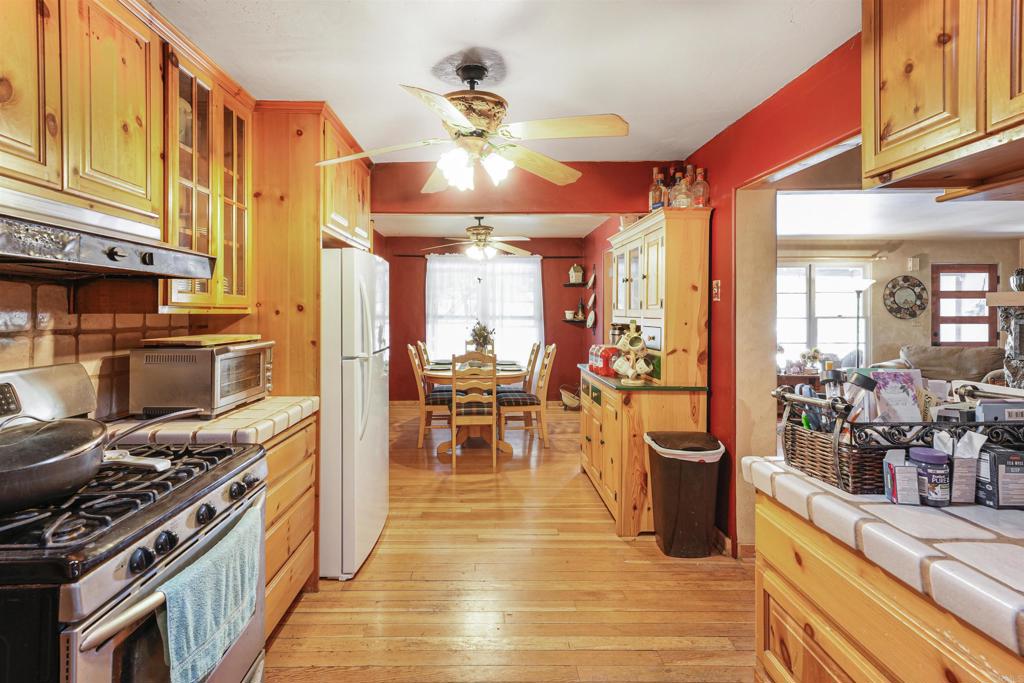 29012 Oak Lane Pine Valley, CA 91962 - Photo 5 of 38 a kitchen with stainless steel appliances granite countertop a stove oven and a dining table with wooden floor