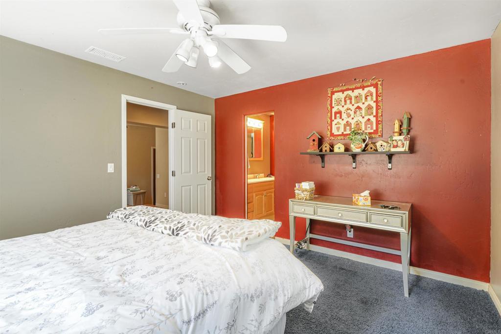 29012 Oak Lane Pine Valley, CA 91962 - Photo 8 of 38 a bedroom with a bed and a chandelier