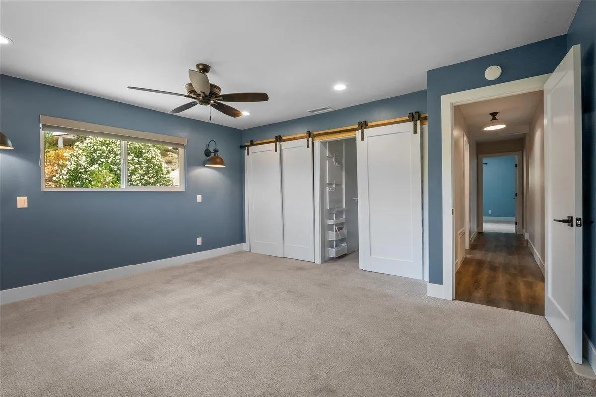 20809 Viento Valle Escondido, CA 92025 - Photo 13 of 23 an empty room with windows and fan