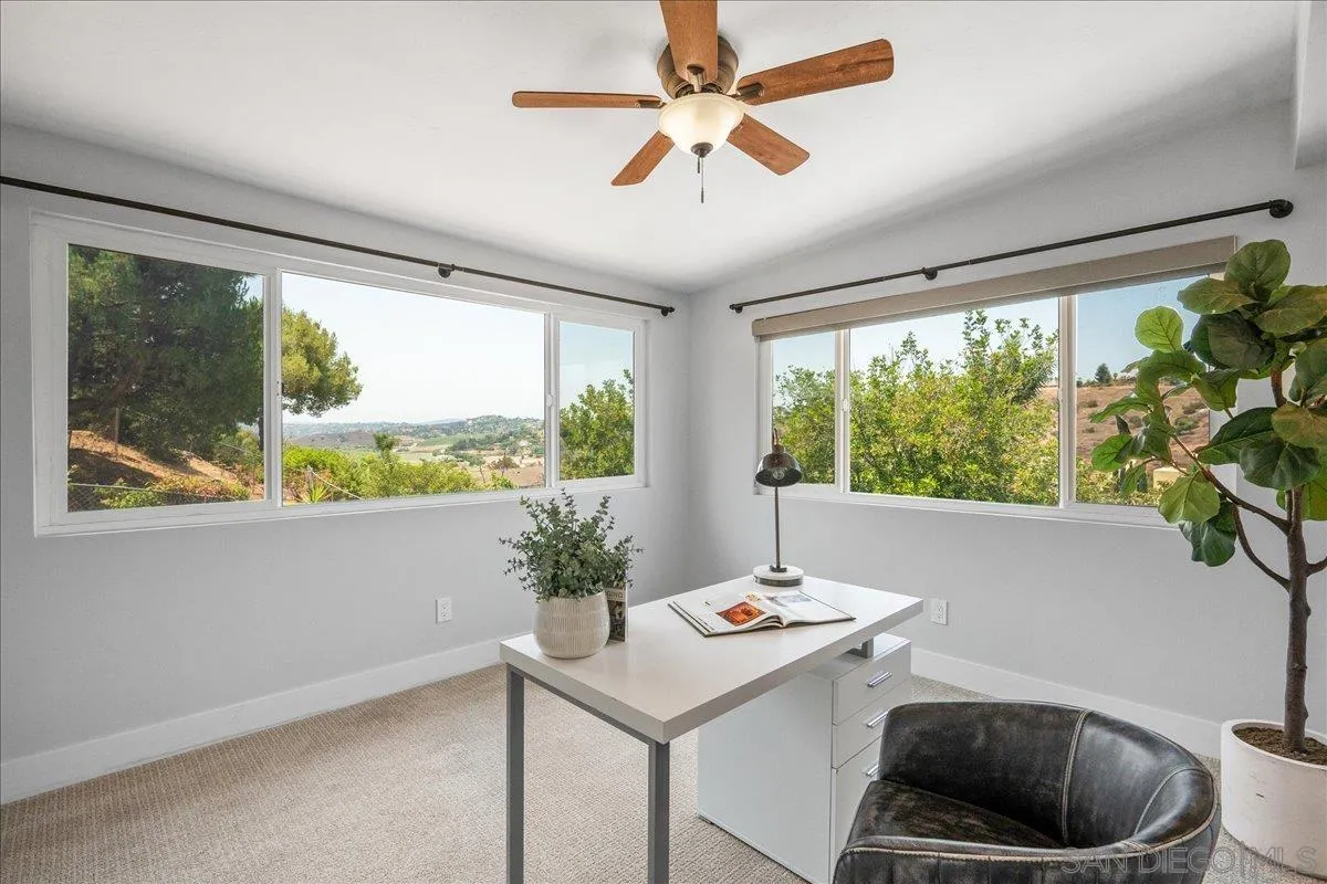 20809 Viento Valle Escondido, CA 92025 - Photo 15 of 23 a view of a room that has a bed and a potted plant