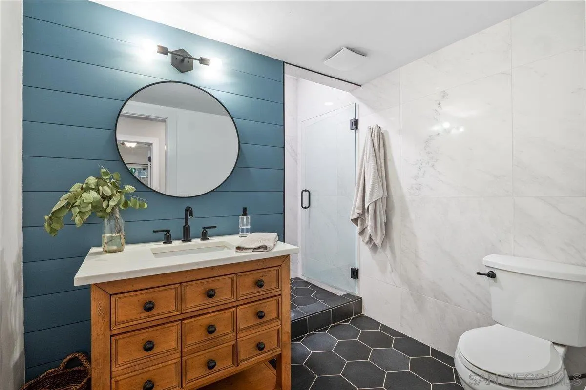 20809 Viento Valle Escondido, CA 92025 - Photo 17 of 23 a bathroom with a sink mirror and toilet