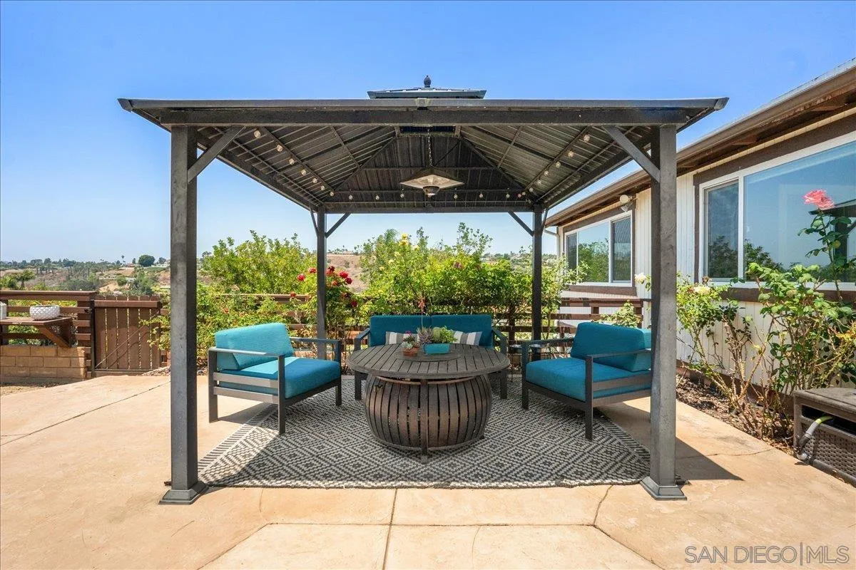 20809 Viento Valle Escondido, CA 92025 - Photo 20 of 23 a view of roof deck with table and chairs potted plants with sky view