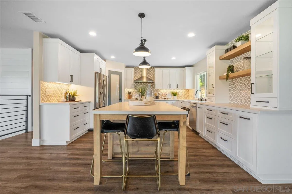20809 Viento Valle Escondido, CA 92025 - Photo 5 of 23 a kitchen with stainless steel appliances kitchen island granite countertop a stove a sink and a refrigerator