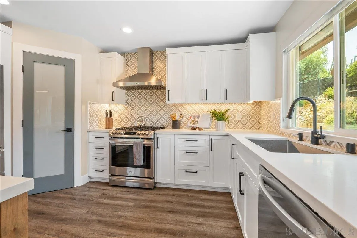 20809 Viento Valle Escondido, CA 92025 - Photo 7 of 23 a kitchen with a stove a sink and a window