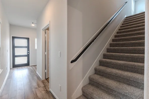 a view of entryway with wooden floor