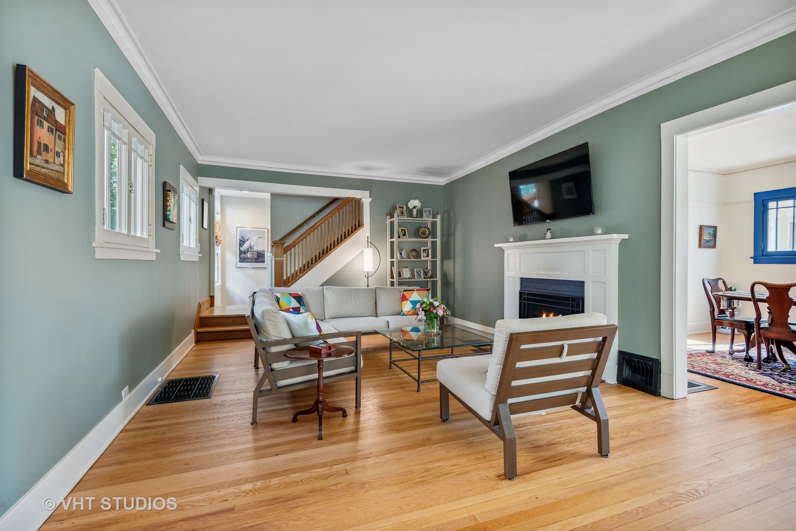 561 Elder Lane Winnetka, IL 60093 - Photo 2 of 26 a living room with furniture a fireplace and a flat screen tv