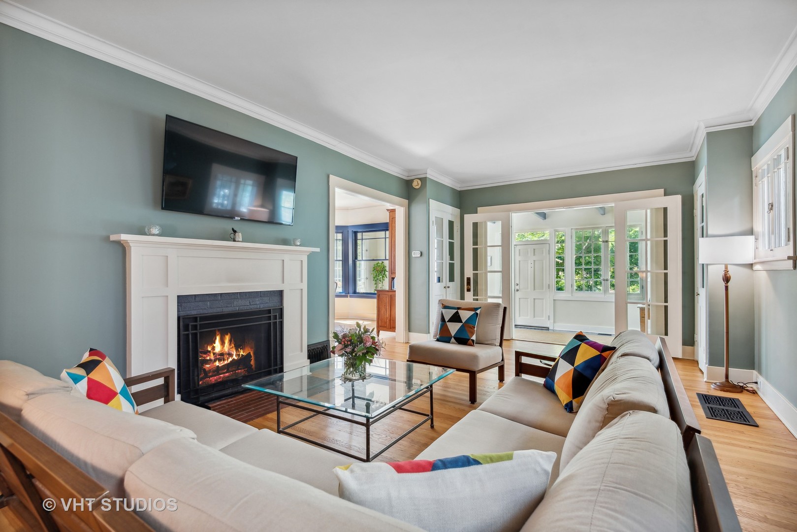 561 Elder Lane Winnetka, IL 60093 - Photo 3 of 26 a living room with furniture and a fireplace