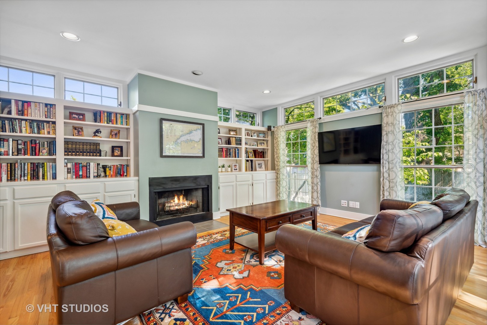 561 Elder Lane Winnetka, IL 60093 - Photo 7 of 26 a living room with furniture window and a fireplace