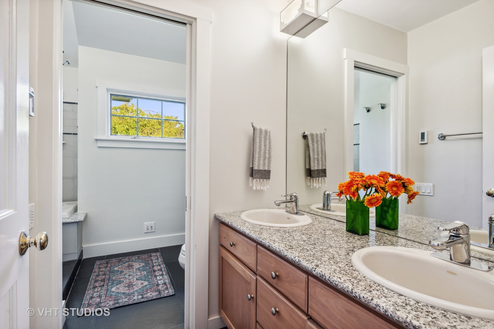 561 Elder Lane Winnetka, IL 60093 - Photo 9 of 26 a bathroom with a granite countertop sink and a mirror