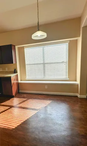a view of livingroom with furniture wooden floor and window
