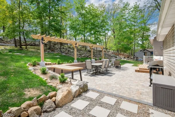 a view of a backyard with sitting area