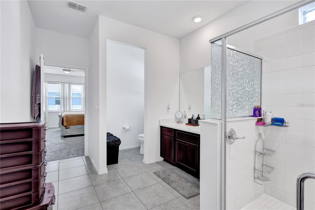 7185 Southwest 63rd Street Ocala, FL 34474 - Photo 18 of 31 a bathroom with a sink and a mirror