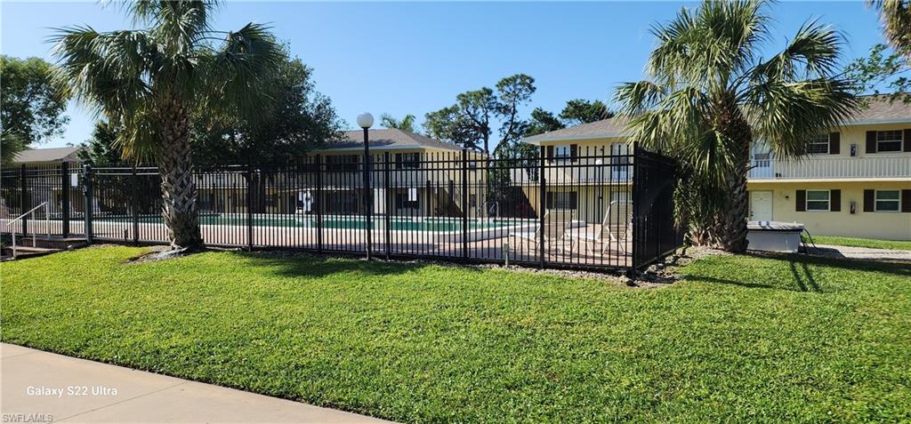 3325 Airport Road North, Unit J3 Naples, FL 34105 - Photo 2 of 13 a view of a garden with a slide