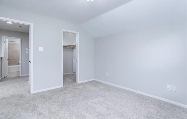 a view of an empty room and closet