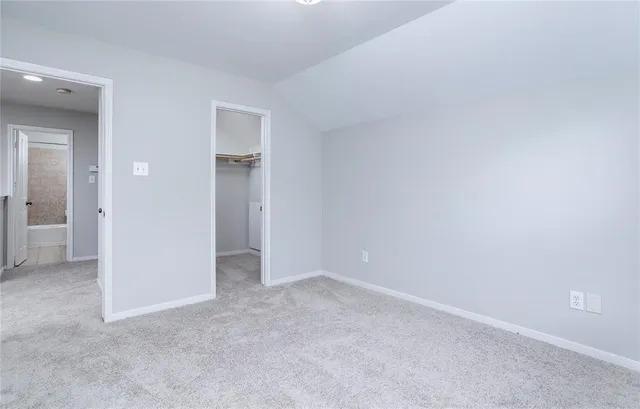 a view of an empty room and closet